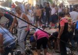 إنقاذ امراة مسنة من تحت ركام المبنى المنهار في طرابلس